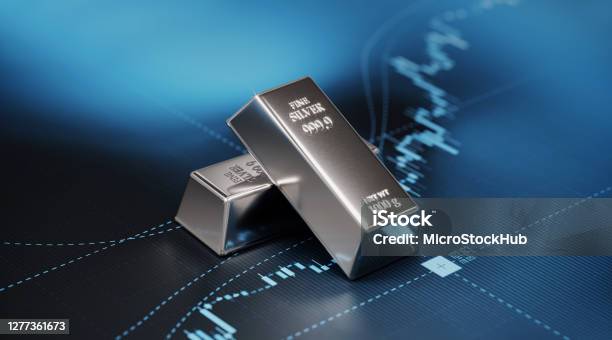 Silver Bars Sitting On Blue Bar Graph Stock Market And Finance Concept Stock Photo - Download Image Now