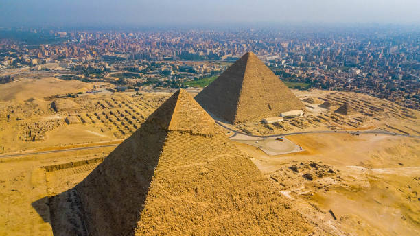 historical giza pyramids in egypt shot by drone. - giza plateau fotos imagens e fotografias de stock