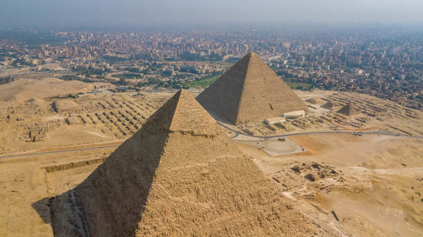 Historical Giza pyramids in Egypt shot by drone. Historical Giza pyramids in Egypt shot by drone. kheops pyramid stock pictures, royalty-free photos & images