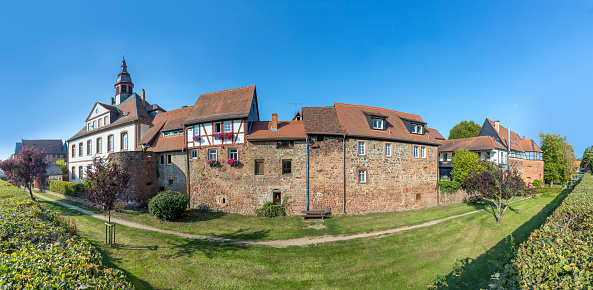 view to historic city wall with half timbered houses in Budingen, Germany
