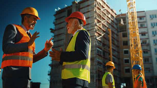 istock Group of contractors supervising building process 1277363893
