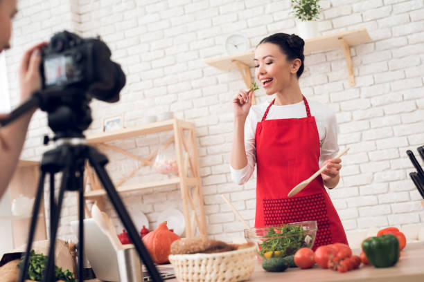 istock Young culinary bloggers tasting salad. 1277365837