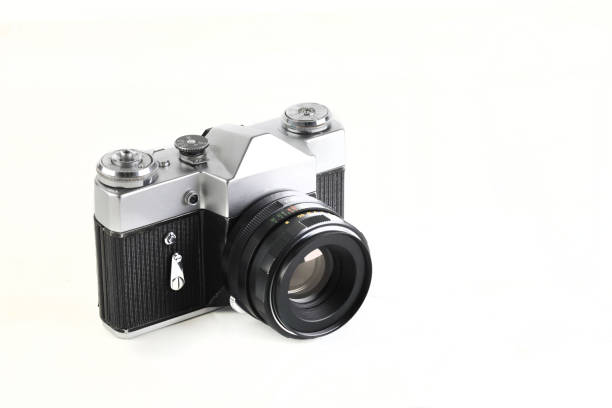 istock Old 35 mm SLR camera , released 70's on white background. 1277365869