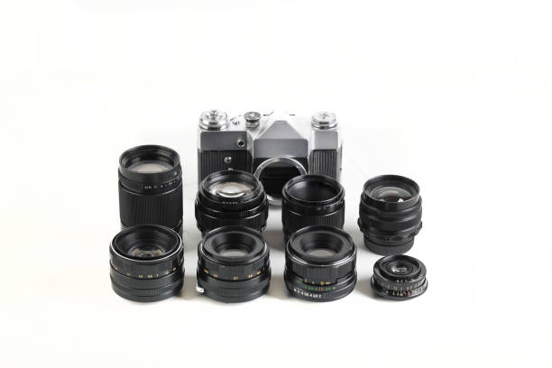 istock Old 35 mm SLR camera , released 70's on white background. 1277365872