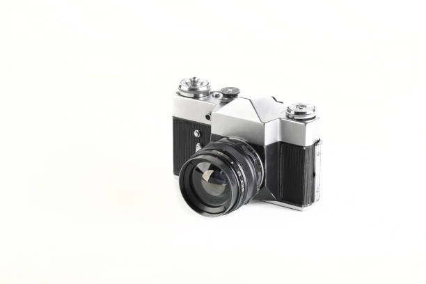 istock Old 35 mm SLR camera , released 70's on white background. 1277365874