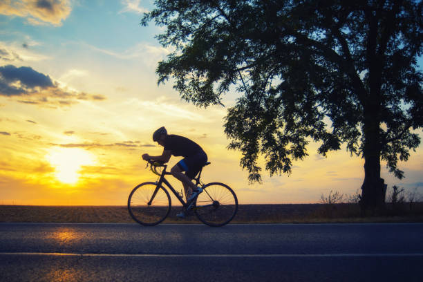 istock Man cycling on the road 1277365925