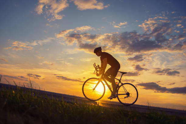 istock Man cycling on the road 1277365969