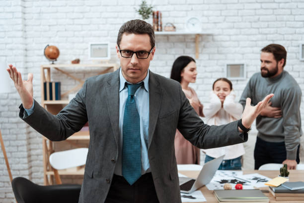 istock A man stands in a tie and spreads his hands. 1277366755