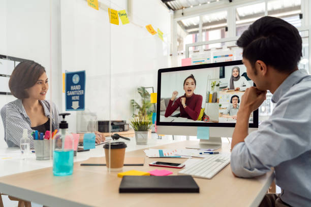 Two businesspersons work from home involved video conference meeting.