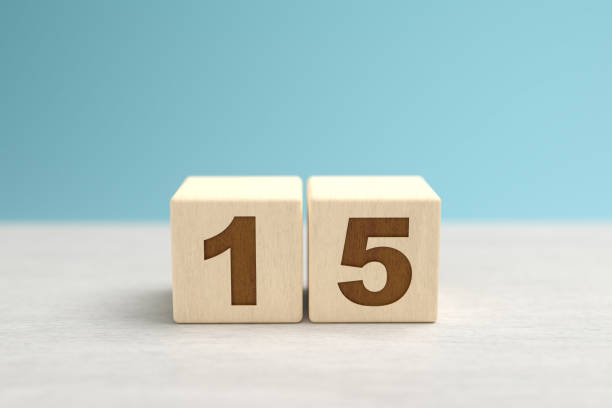 istock Wooden toy blocks forming the number 15. 1277373859