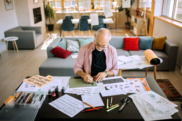 istock Retired calligraphy artist writing at his home office 1277373947