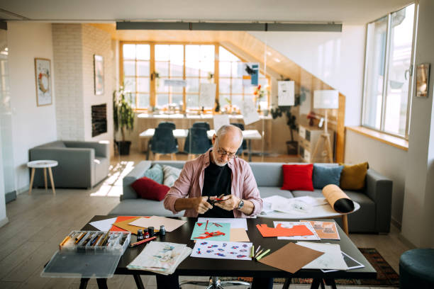 istock Senior artist working on his collage art piece 1277374371