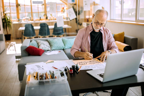 istock Calligraphy senior artist in his home office creating 1277374392