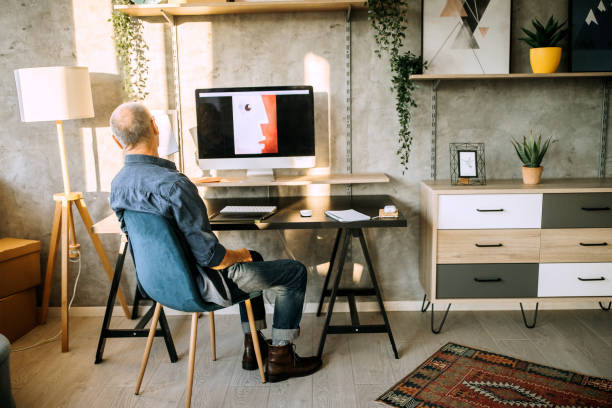 istock Senior graphic designer creating art in his home office studio 1277374482