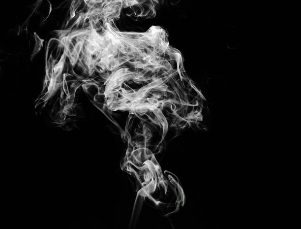 istock abstract fragment movement of white smoke on black background. 1277376042