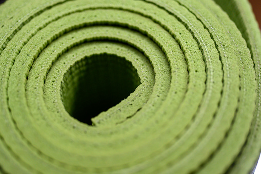 Green spiral yoga mat