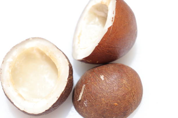 istock Close up view of dried coconut chips on white background in india 1277381894