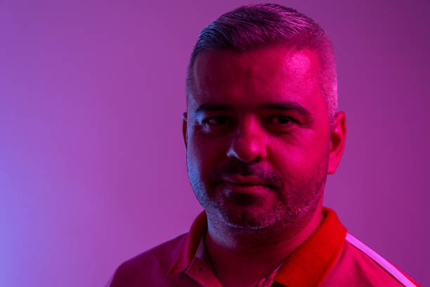 istock Neon portrait of a young attractive man 1277382260