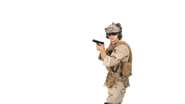 istock Soldier walking aiming with a pistol and shooting to camera on w 1277383102