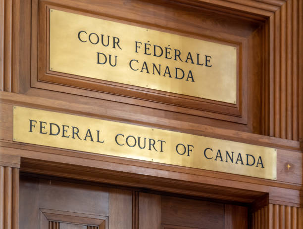 The bilingual English and French sign of the Ferderal Court of Canada inside the Supreme Court of Canada building in Ottawa Ottawa, Canada; Federal Court of Canada inside the historic Supreme Court of Canada building in Ottawa french language photos stock pictures, royalty-free photos & images
