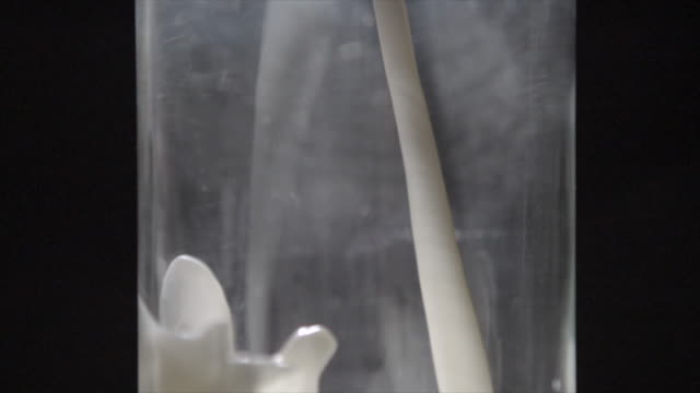 Pouring Fresh Milk Into Glass Slow Motion