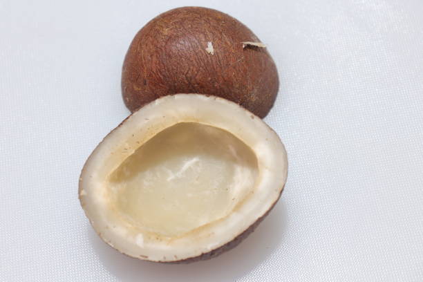 istock Close up view of dried coconut chips on white background in india 1277386003
