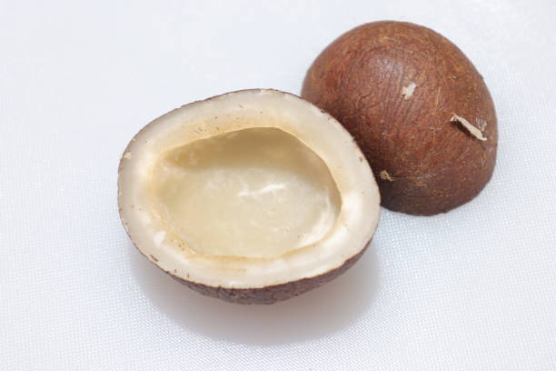 istock Close up view of dried coconut chips on white background in india 1277386964