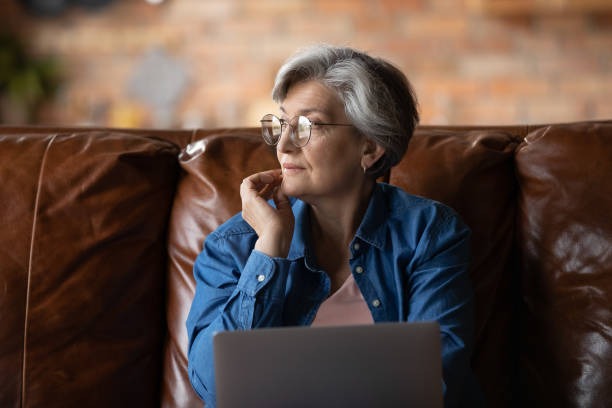 istock Dreamy elderly woman look in distance thinking 1277387036
