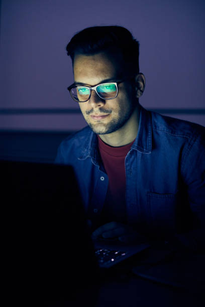 istock laptop computer, night dark looking office late working ciner crime theft 1277387037