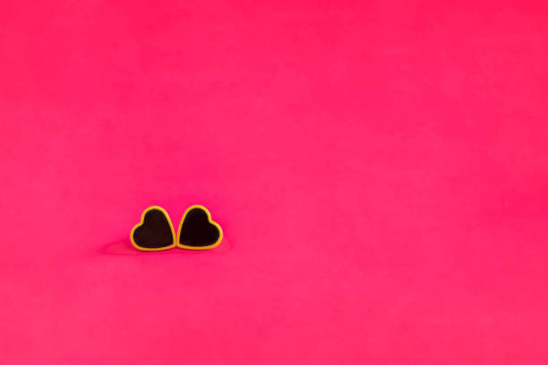 istock Composition for Valentine's Day. Two hearts on a pink background. Flat lay, copy space, template. 1277387352