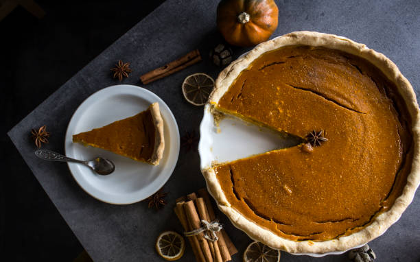istock Squash tart close up photo. Pumpkin pie on a table. 1277389718