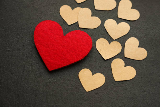 istock Heart Shapes on Black Background 1277391350
