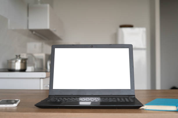 istock Laptop with blank screen on white desk with blurred background 1277391529