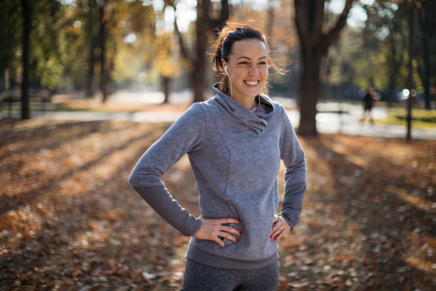 istock Beautiful Caucasian female jogger smiling 1277393323