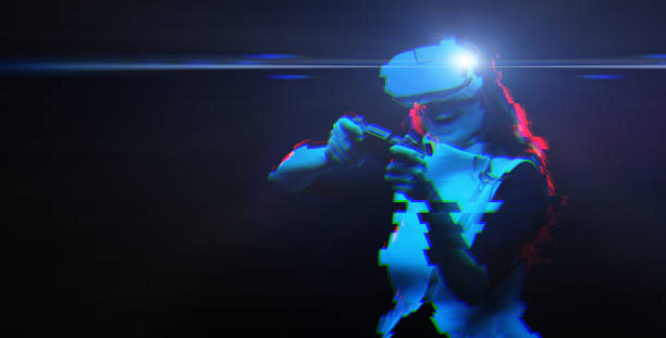 istock Woman with virtual reality headset is playing game. Image with glitch effect. 1277396204
