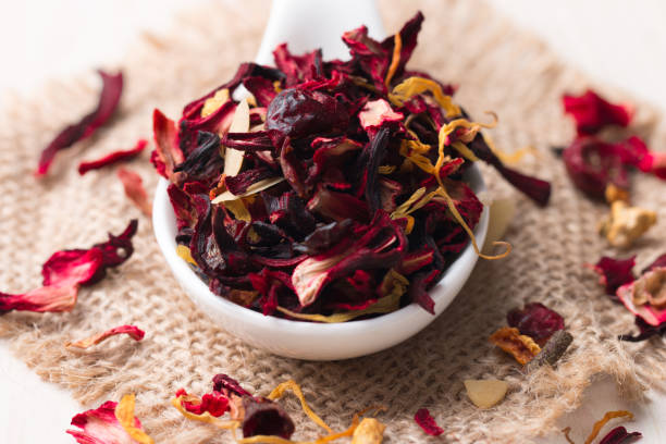 istock Dry red floral fruit and herbal hibiscus tea with petals 1277396384