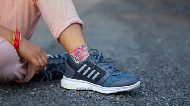 istock Young female jogger athlete training and doing workout outdoors in the garden background 1277396756