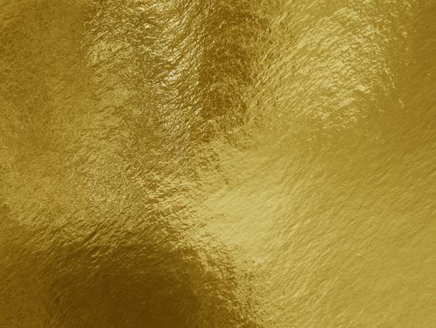 istock Gold foil background with highlights and uneven texture 1277397614