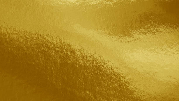 istock Gold foil background with highlights and uneven texture 1277397678