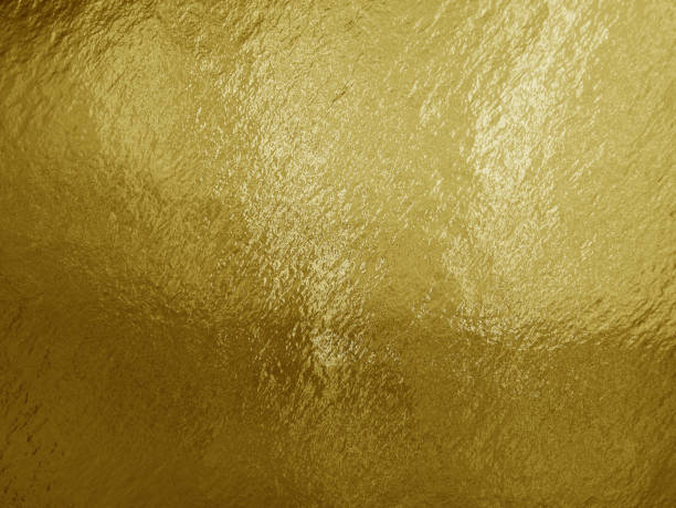 istock Gold foil background with highlights and uneven texture 1277397712