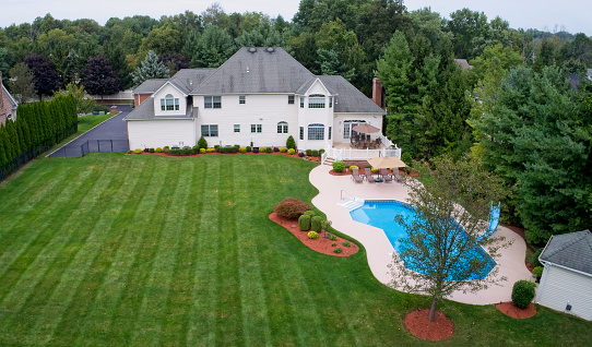 Large house estate property aerial, back yard
