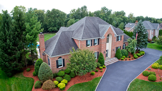 Looking down at front of luxury home. Shot with Phantom 4 Pro, drone. 20MP camera.