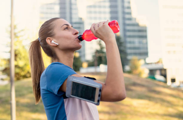 istock Sporty woman taking a break after running workout 1277400674