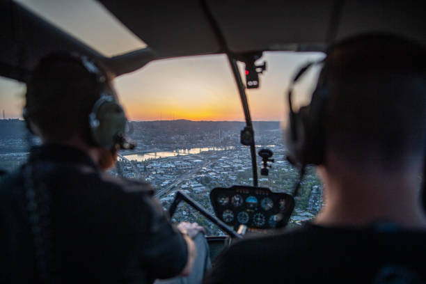 istock Two people Flying A Helicopter During Sunset 1277400803