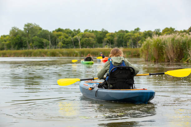istock Girl In Blue Kayak on Cloudy Day 1277402771