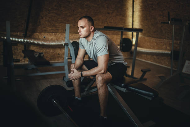 istock Sportsman resting on bench press in the gym 1277402817