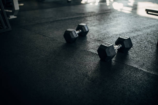 Two dumbbells on the floor in gym