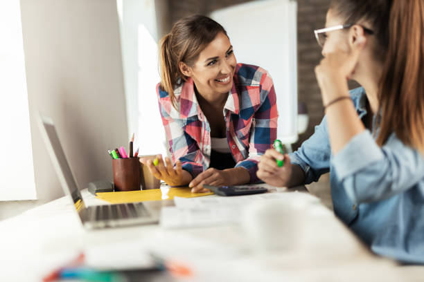istock Happy business women having fun while working in the office 1277404049