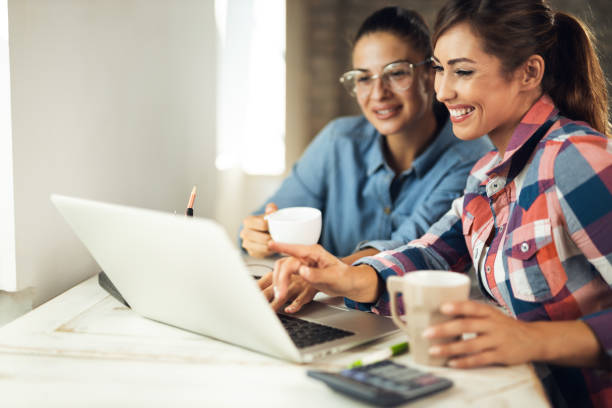 istock Happy creative women working on laptop in the office 1277404842