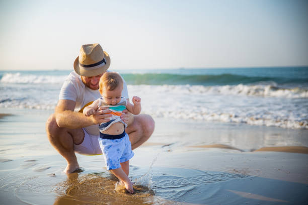 istock Father and son at the beach 1277406142